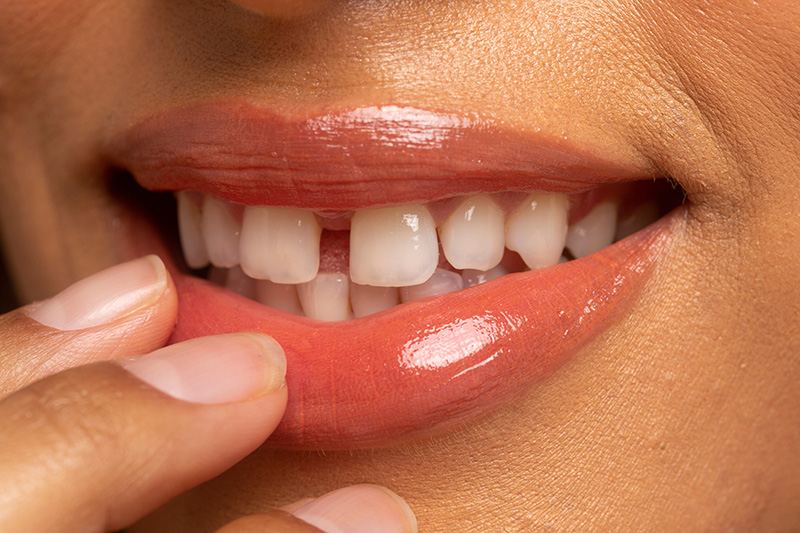 Close-up of smiling woman's lips